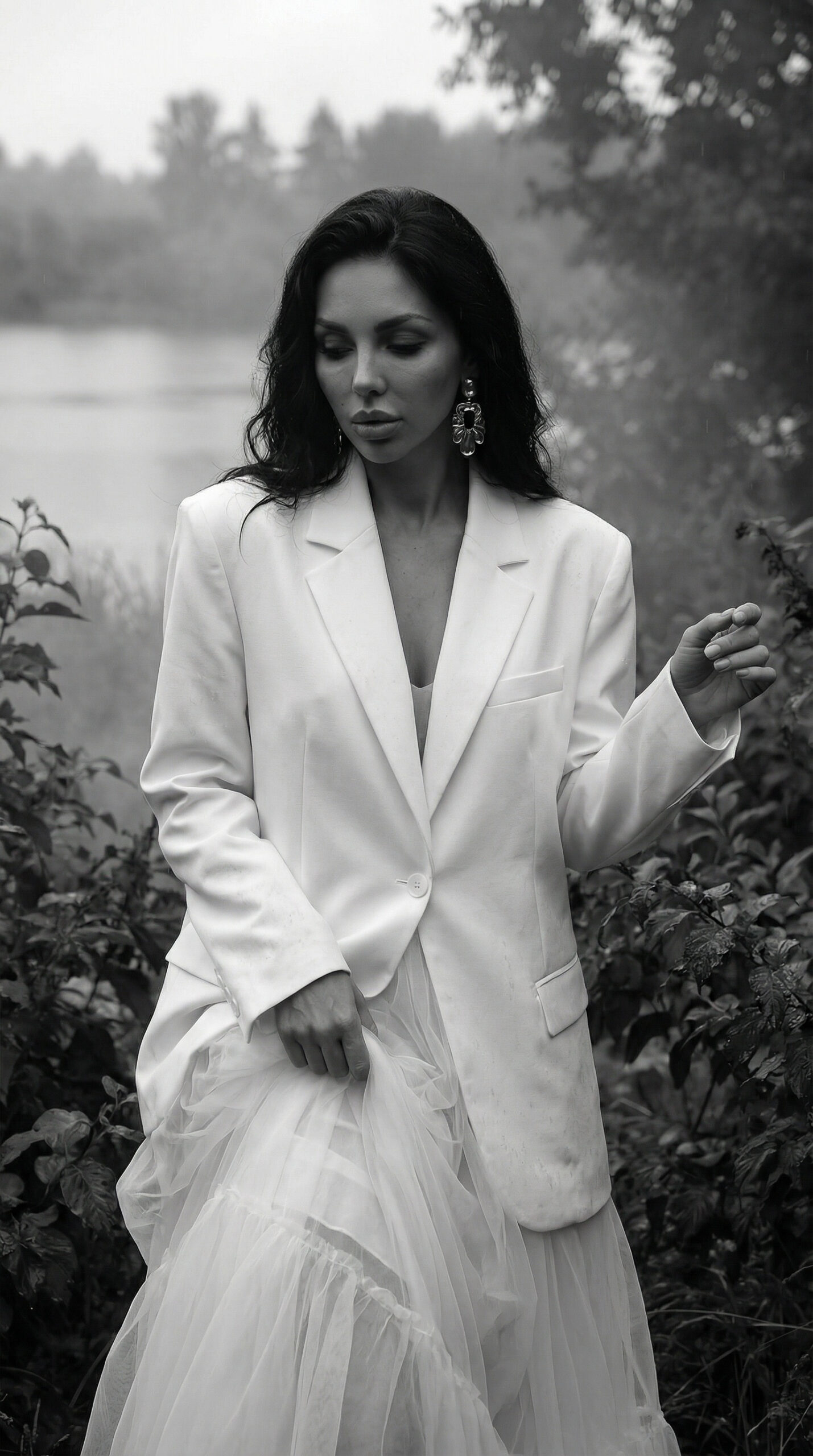 A cinematic couture fashion editorial set beside a mist-covered forest lake.